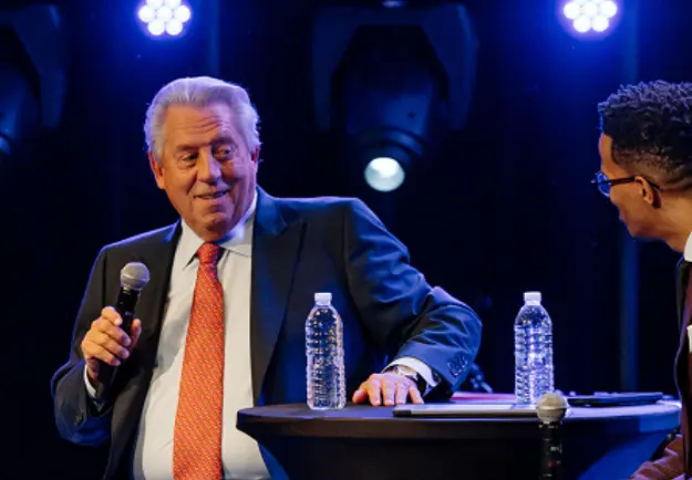 John C. Maxwell on stage at a past Live2Lead